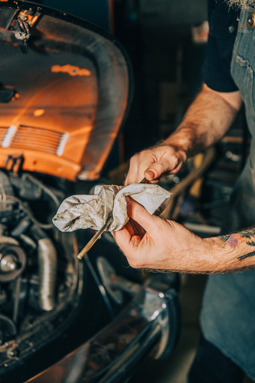 Mechanic Wiping a Tool